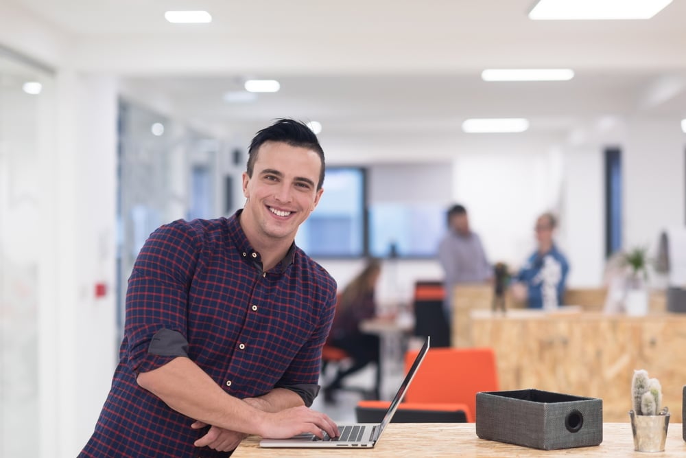 portrait of young businessman in casual clothes at modern  startup business office space,  working on laptop  computer-1